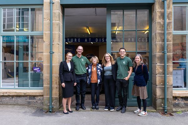 Cat Smith with three generations of the Smillie family, Quality Plus Furniture